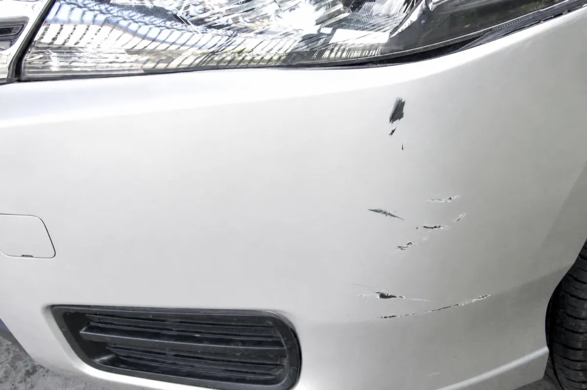 Front bumper dent massaged out with PDR, no repaint needed in Mesa, AZ, after